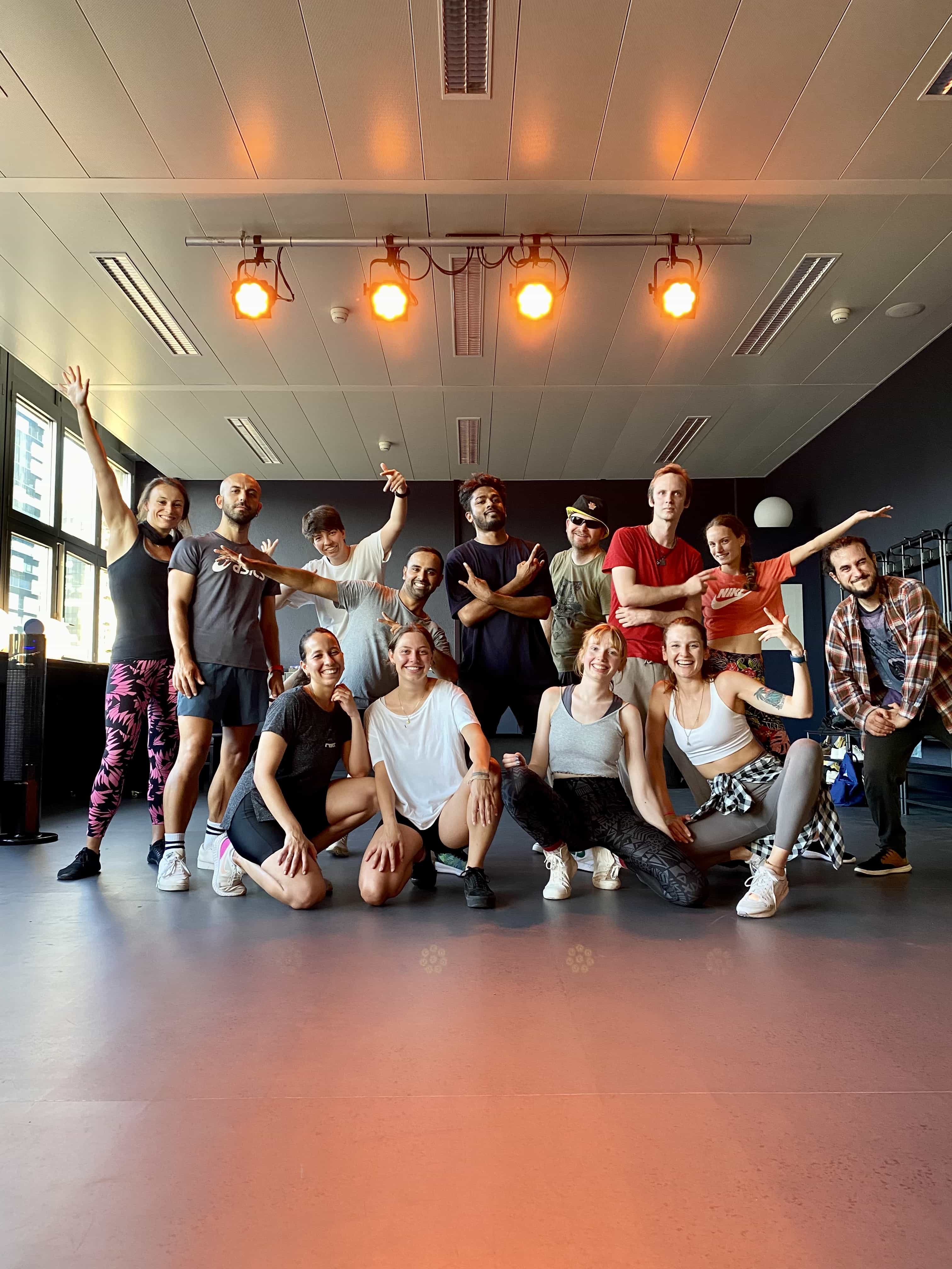 Adults from English dance lessons pose for a Christmas video in the center of Zurich